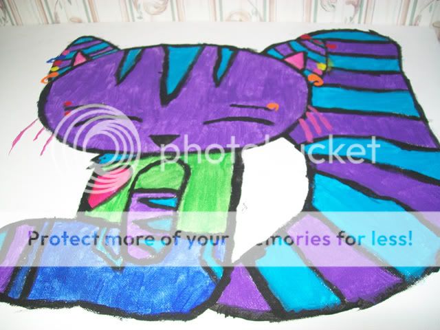 And here is her very colorful and very pierced up Cheshire Cat. And here is her very colorful and very pierced up Cheshire Cat.